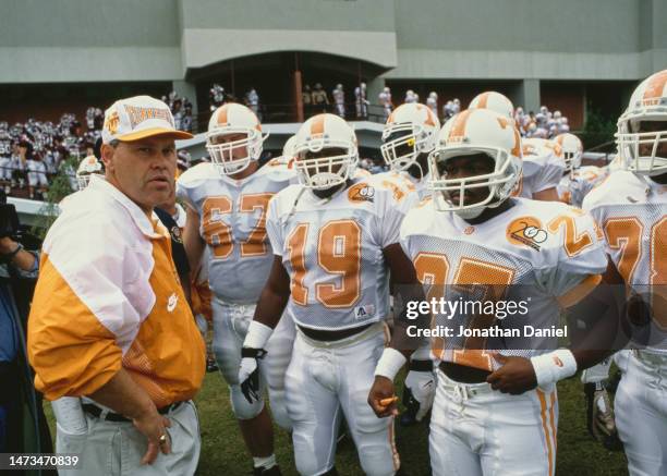 Phillip Fulmer, Head Coach for the University of Tennessee Volunteers stands with his team during the NCAA Southeastern Conference college football...