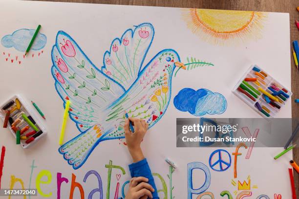 promoting harmony through art - peace sign hand drawing stock pictures, royalty-free photos & images