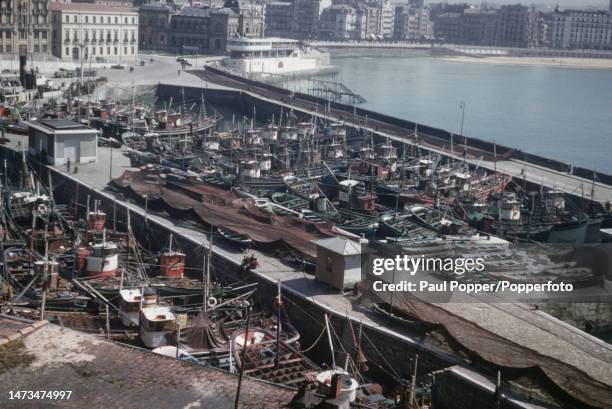 Fishing boats moored in the harbour of the Port of San Sebastian in the town of San Sebastian on La Concha Bay, capital city of the province of...