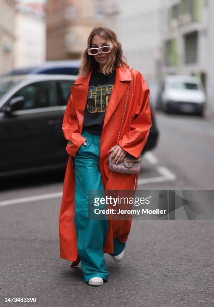 Karin Teigl seen wearing Loewe light pink sunglasses, gold / silver jewelry, Samsoe Samsoe turquoise / blue leather pants, Chanel colorful fabric...