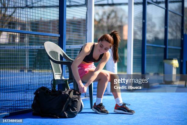 young people playing padel tennis, preparation - using a paddle imagens e fotografias de stock