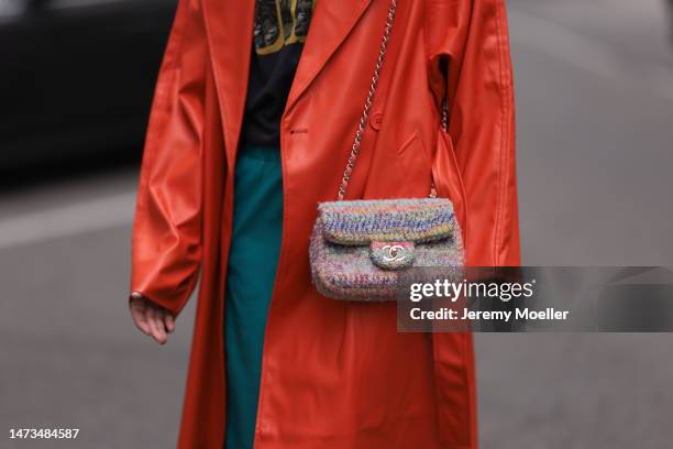 Karin Teigl seen wearing Samsoe Samsoe turquoise / blue leather pants, Chanel colorful fabric crossbody bag, Mother Denim black logo printed cotton...