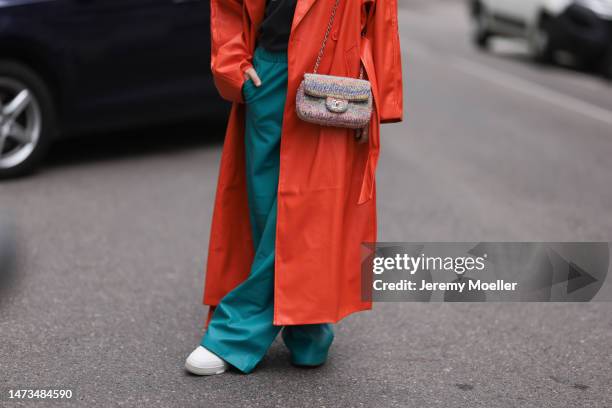 Karin Teigl seen wearing Samsoe Samsoe turquoise / blue leather pants, Chanel colorful fabric crossbody bag, Mother Denim black logo printed cotton...