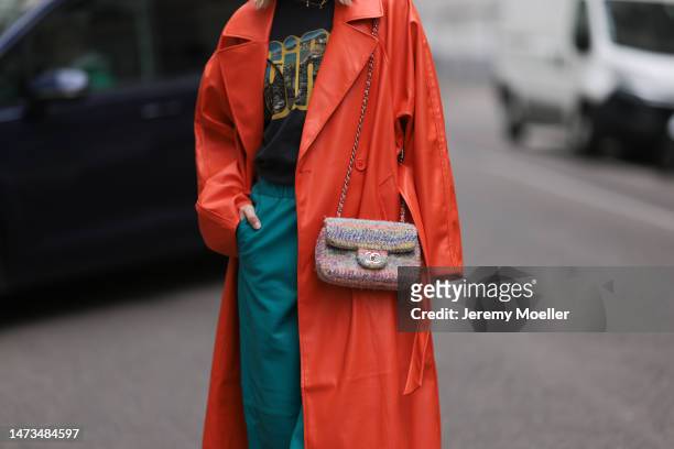 Karin Teigl seen wearing Samsoe Samsoe turquoise / blue leather pants, Chanel colorful fabric crossbody bag, Mother Denim black logo printed cotton...