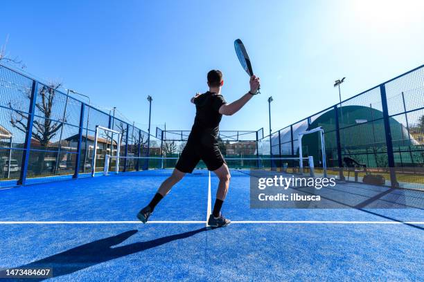 young people playing padel tennis - racquet stockfoto's en -beelden