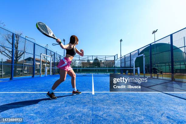 young people playing padel tennis - paddle tennis stock pictures, royalty-free photos & images