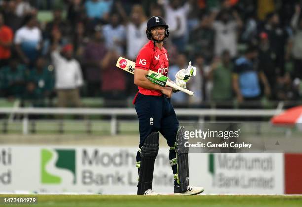 Jos Buttler of England reacts after being dismissed during the 3rd T20 International match between Bangladesh and England at Sher-e-Bangla National...
