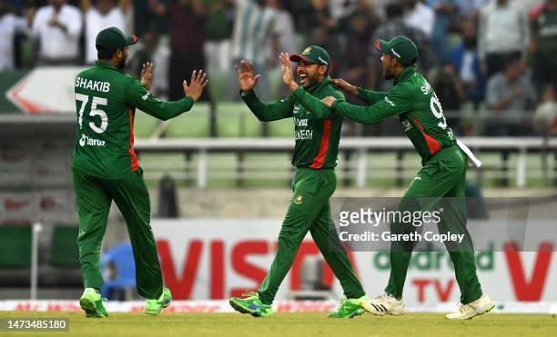 Mehidy Hasan of Bangladesh celebrates the wicket of Jos Buttler of England during the 3rd T20 International match between Bangladesh and England at...