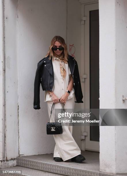 Karin Teigl seen wearing Rhude black sunglasses, CYK by Constantly K beige silk scarf, CYK by Constantly K linen button shirt and matching linen long...