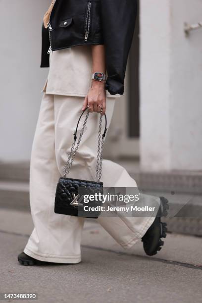 Karin Teigl seen wearing CYK by Constantly K linen button shirt and matching linen long pants, The Frankie Shop black leather biker jacket, Louis...