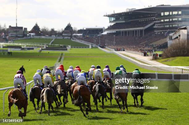 Runners make their way around the course during the Sky Bet Supreme Novices Hurdle during day one of the Cheltenham Festival 2023 at Cheltenham...