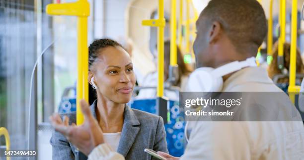 business people talking in bus - black jacket stock pictures, royalty-free photos & images