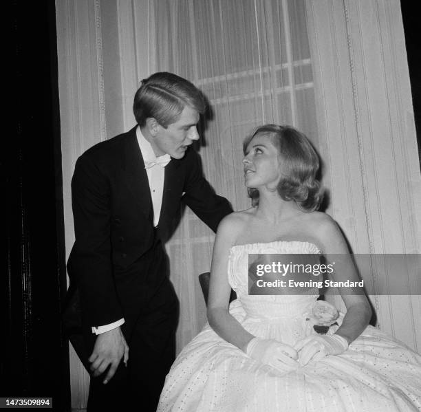 British singer Adam Faith and actress Susannah York attend the London premiere of the film 'The Facts of Life' at the Odeon Leicester Square on...