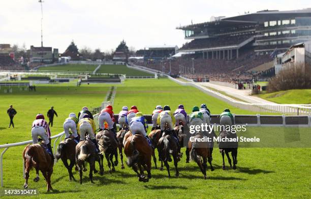 Runners make their way around the course during the Sky Bet Supreme Novices Hurdle during day one of the Cheltenham Festival 2023 at Cheltenham...