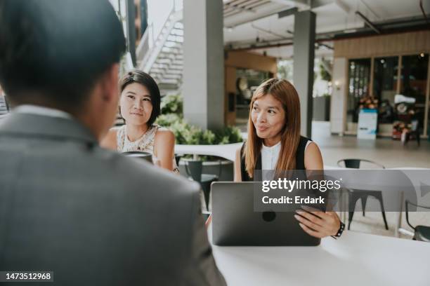 small business meeting before presenting work to client - southeast asian ethnicity stock pictures, royalty-free photos & images