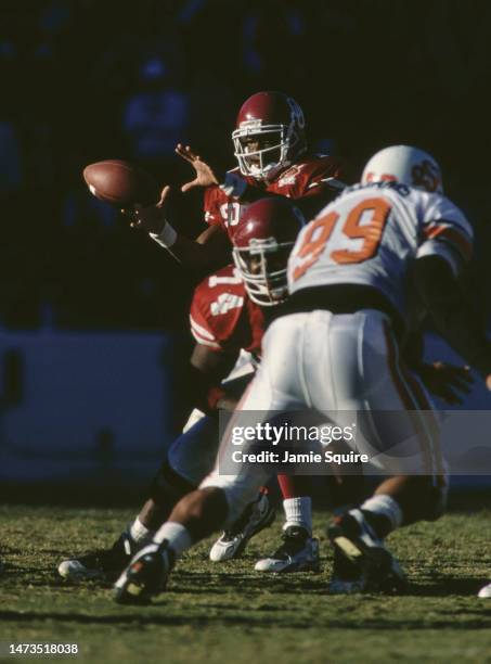 Eric Moore, Quarterback for the University of Oklahoma Sooners calls the play at the line of scrimmage during the NCAA Big 8 Conference college...