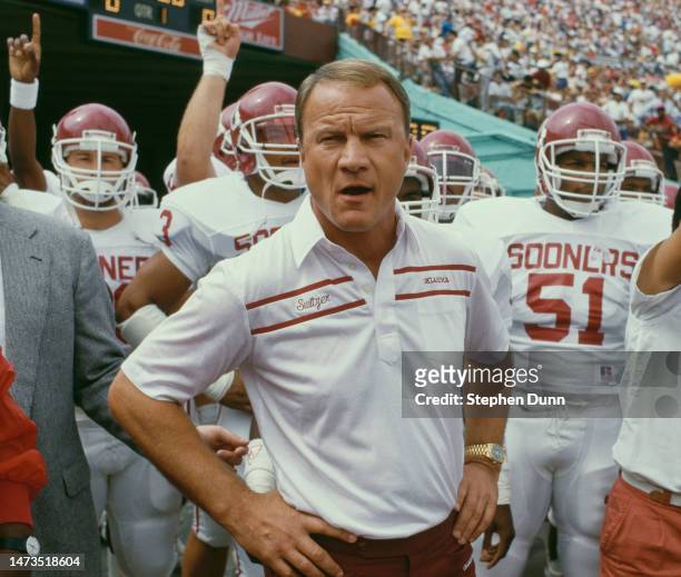 Barry Switzer, Head Coach for the University of Oklahoma Sooners leads the team onto the field during a NCAA Pac-10 Conference college football game...