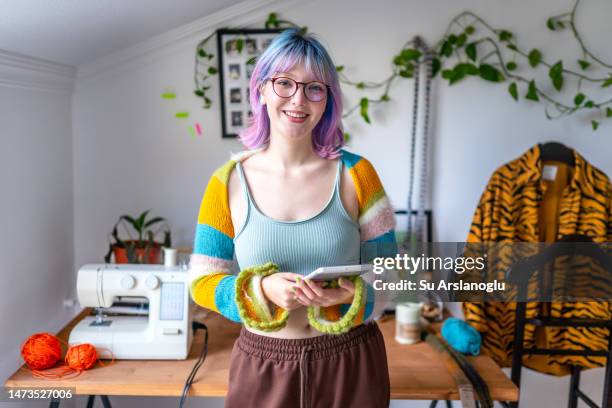 portrait of a young fashion designer in her workshop - shopping online blue stock pictures, royalty-free photos & images