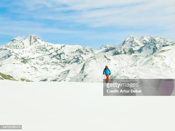 skier posing at top of hill skiing with the french alps mountains in the background. - tignes stock pictures, royalty-free photos & images