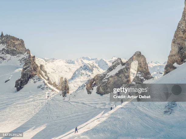 the snowy french alps mountains with rock formations in the tignes ski resort. - french alps stock pictures, royalty-free photos & images