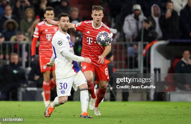 Lionel Messi of PSG, Joshua Kimmich of Bayern Munich during the UEFA Champions League round of 16 leg two match between FC Bayern Munich and Paris...