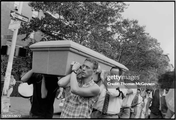 Pall bearers carry the coffin of AIDS activist Jon Greenberg during a political funeral on July 13, 1993 in New York City in New York.