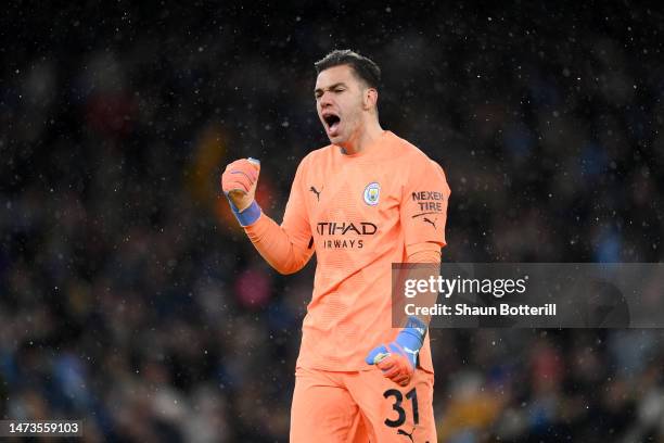 Ederson of Manchester City celebrates the team's first goal scored by Erling Haaland of Manchester City during the UEFA Champions League round of 16...