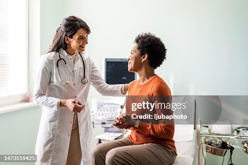 Female medical practitioner reassuring a patient Female medical practitioner reassuring a patient