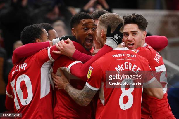 Chuba Akpom of Middlesbrough celebrates with teammates after scoring the team's first goal during the Sky Bet Championship between Middlesbrough and...