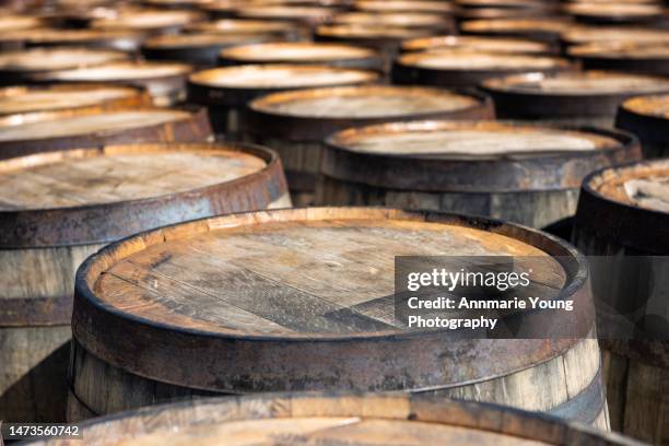 photo of whisky barrels - holzfass stock-fotos und bilder
