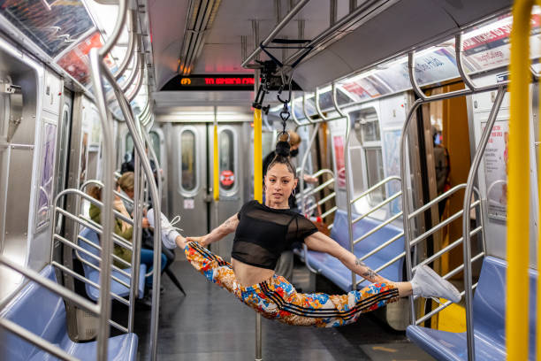 NY: Aerialist Erin Blaire Performs On NYC Subway