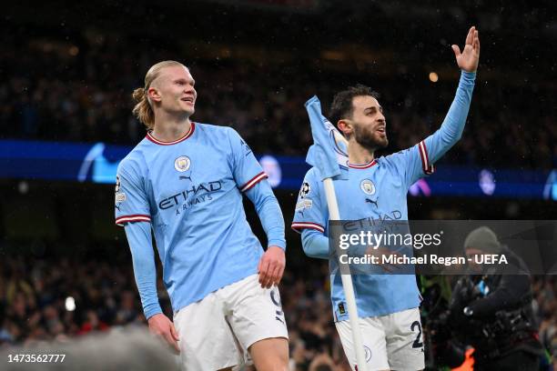 Erling Haaland of Manchester City celebrates with Bernardo Silva after scoring the team's second goal during the UEFA Champions League round of 16...