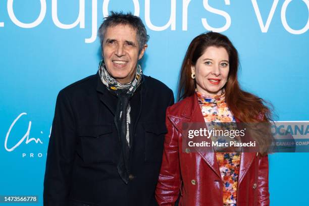 Julien Clerc and Helene Gremillon attend the "Je Verrai Toujours Vos Visages" premiere at Cinema UGC Normandie on March 14, 2023 in Paris, France.