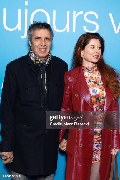 Julien Clerc and Helene Gremillon attend the "Je Verrai Toujours Vos Visages" premiere at Cinema UGC Normandie on March 14, 2023 in Paris, France.