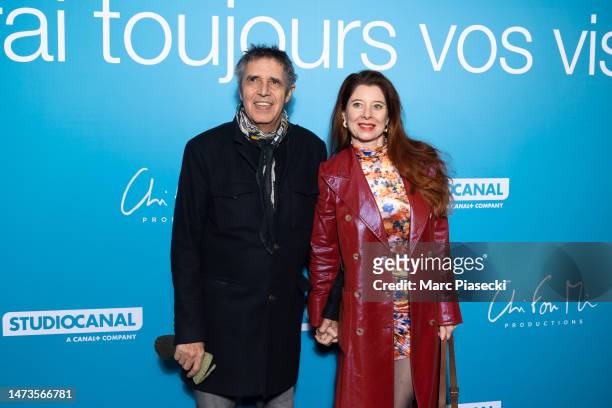 Julien Clerc and Helene Gremillon attend the "Je Verrai Toujours Vos Visages" premiere at Cinema UGC Normandie on March 14, 2023 in Paris, France.