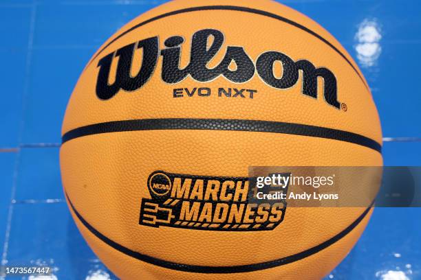 Detailed view of the March Madness logo is seen on a basketball prior to the First Four of the NCAA Men's Basketball Tournament at University of...