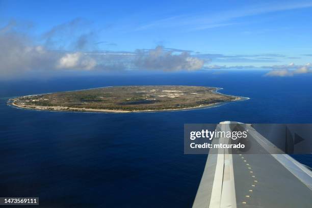 nauru island from the air, with boeing 737 starboard wing - south pacific ocean - nauru stock pictures, royalty-free photos & images