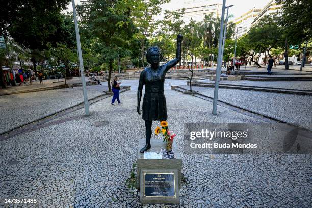 The statue of councilwoman Marielle Franco receives flowers and messages during tributes to demand justice for her murder on March 14, 2023 in Rio de...