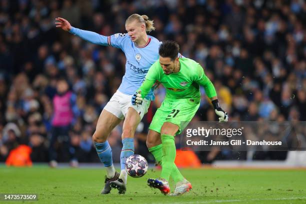 Erling Haaland of Manchester City battles for possession with Janis Blaswich of RB Leipzig during the UEFA Champions League round of 16 leg two match...