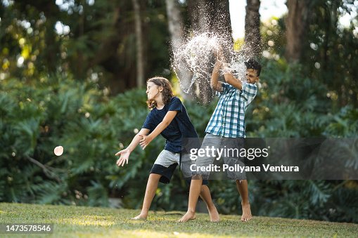 Kids playing water bubble fight