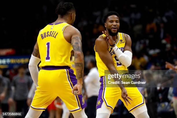 Malik Beasley of the Los Angeles Lakers reacts after scoring a three-point basket during the first quarter of an NBA game against the New Orleans...