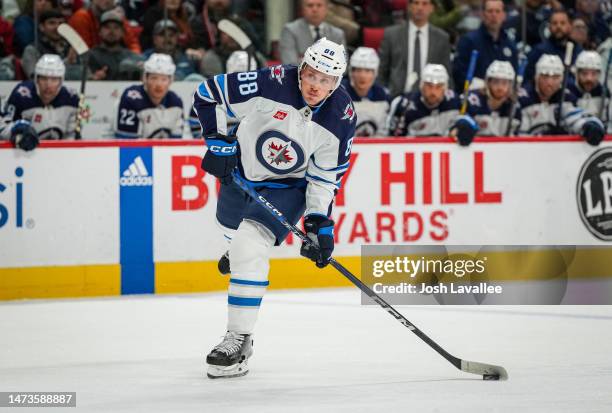 Nate Schmidt of the Winnipeg Jets shoots the puck during the second period against the Carolina Hurricanes at PNC Arena on March 14, 2023 in Raleigh,...