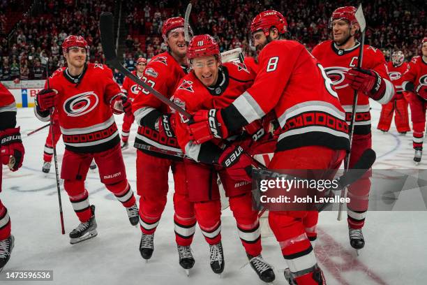 The Carolina Hurricanes celebrate with the Storm Surge after defeating the Winnipeg Jets at PNC Arena on March 14, 2023 in Raleigh, North Carolina.