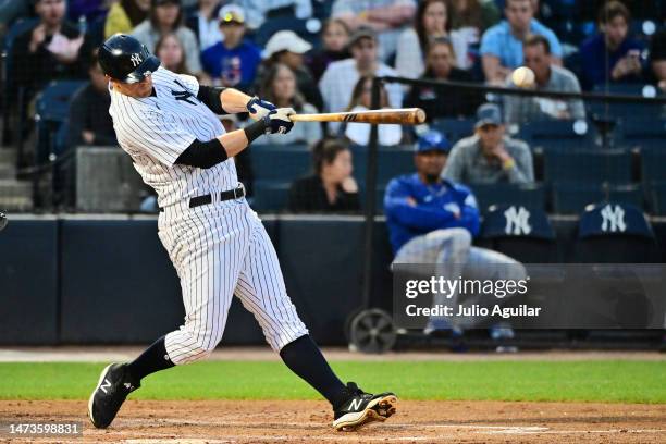 LeMahieu of the New York Yankees hits a single in the third inning against the Toronto Blue Jays during a Grapefruit League Spring Training Game at...