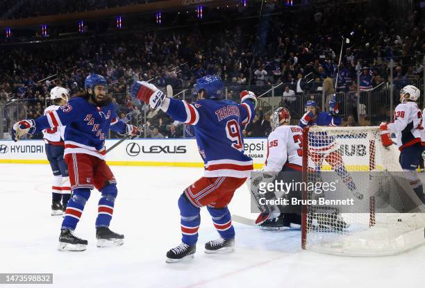 Mika Zibanejad of the New York Rangers celebrates his first period goal against the Washington Capitals and is joined by Vladimir Tarasenko at...