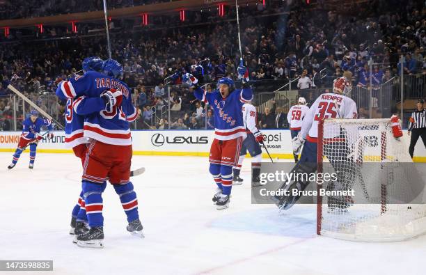 Mika Zibanejad of the New York Rangers celebrates his first period goal against the Washington Capitals and is joined by Vladimir Tarasenko at...