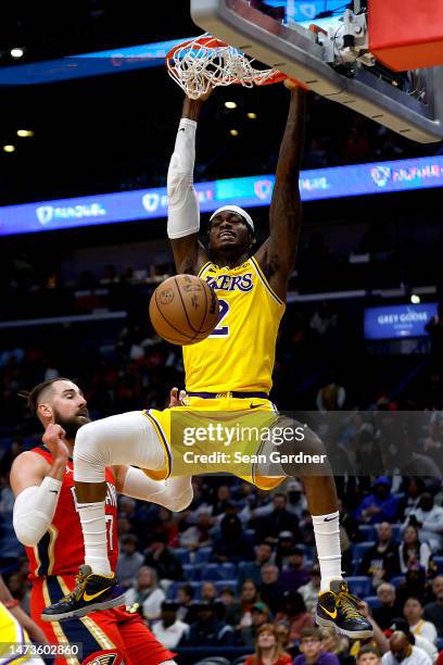 Jarred Vanderbilt of the Los Angeles Lakers dunks over Jonas Valanciunas of the New Orleans Pelicans during the third quarter at Smoothie King Center...