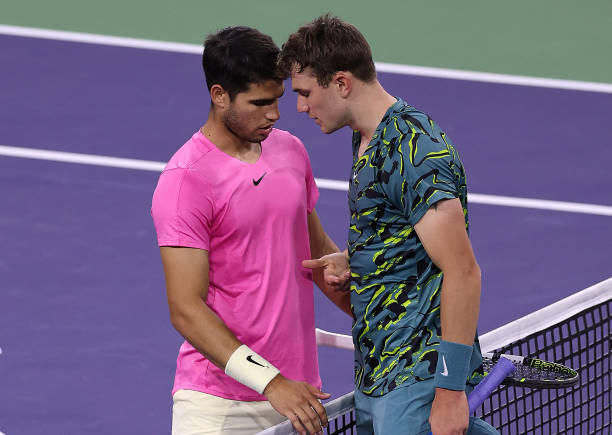 Carlos Alcaraz of Spain consoles Jack Draper of Great Britain after he retired injured during BNP Paribas Open on March 14, 2023 in Indian Wells,...