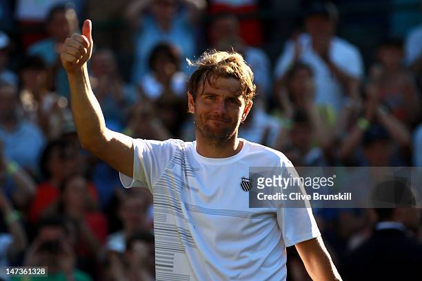 Mardy Fish of the USA celebrates after winning his Gentlemen's Singles second round match against James Ward of Great Britain on day four of the...