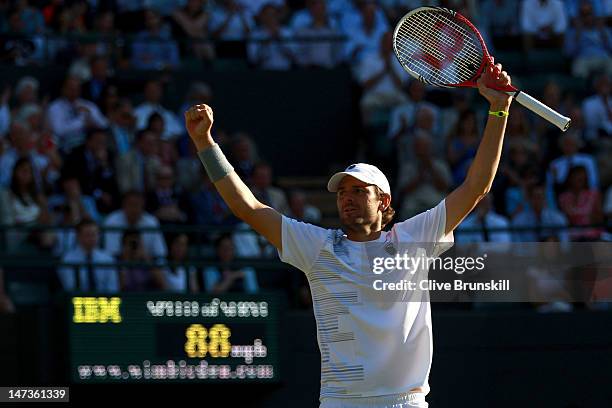 Mardy Fish of the USA celebrates match point during his Gentlemen's Singles second round match against James Ward of Great Britain on day four of the...